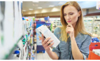 Woman Consumer Inspecting Package