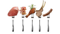 Pieces of meat on forks