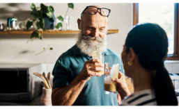 Man and Woman Cheers Health Drinks