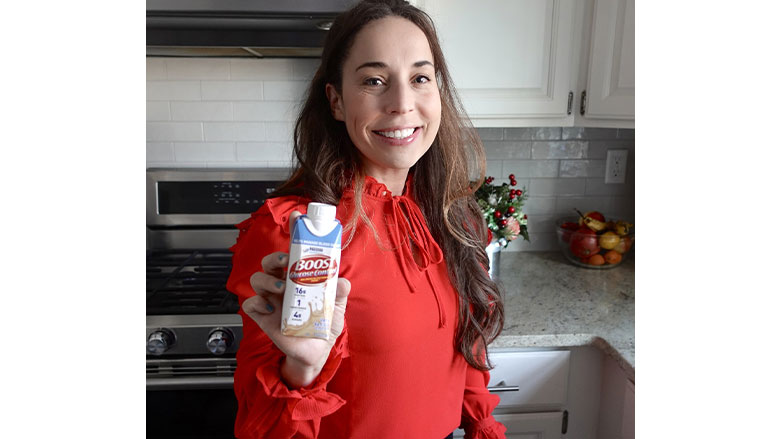 Boost Glucose Control bottle held by human