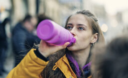 Person drinking sports beverage