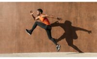 Man Running in Front of Wall