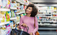 Woman Shopping in Grocery Store Aisle