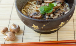 Mushrooms Next to Bowl of Mushroom Miso Ramen