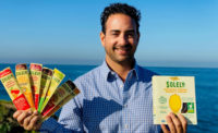 Simon Sacal, CEO of Solely Inc, Holding Two of Solely's Snack Products